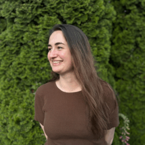 Emma Alsop side profile image with her smiling